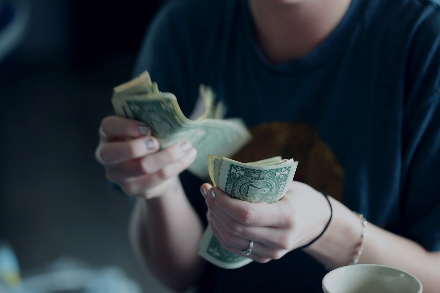 A Woman Is Counting Money